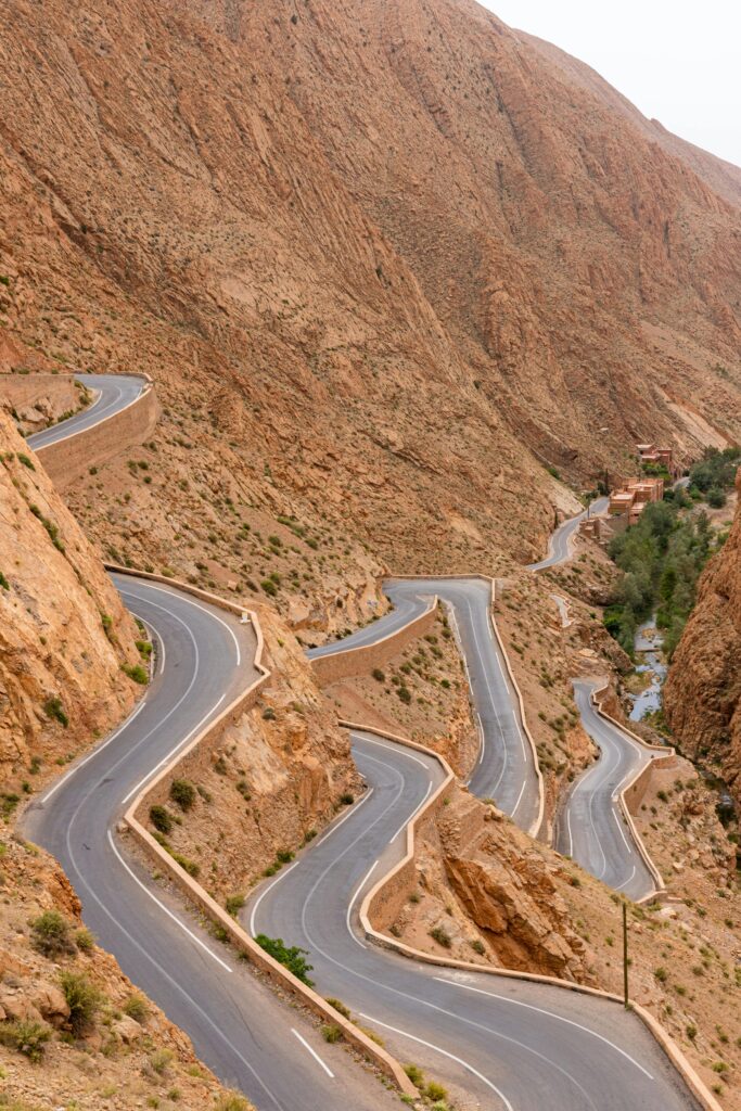 Stunning view of a winding road through arid mountain terrain, perfect for travel inspiration.