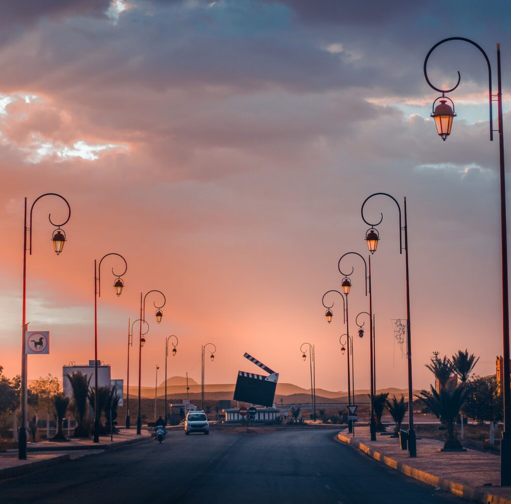Explore the cinematic streets of Ouarzazate, Morocco, under a stunning sunset glow.